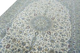 Backside of handmade New Kashan rug showing knot structure and weave density