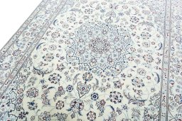 Backside of handmade New Nain rug showing knot structure and weave density