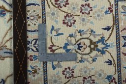 Backside of handmade 2000s Nain rug showing knot structure and weave density