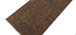 Backside of handmade New Farahan rug showing knot structure and weave density