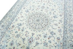 Backside of handmade New Nain rug showing knot structure and weave density