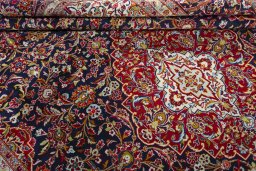Close-up detail of 2000s Kashan rug from Iran / Persia showing Wool weave