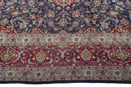 Corner detail of New Kashan rug showing border pattern and Cork pile