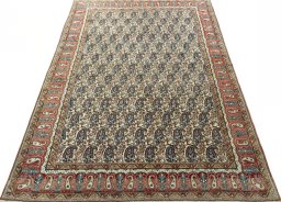 Surface texture of 1950s Ghom rug with natural Wool and intricate pattern