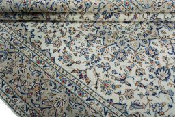 Close-up detail of 2000s Kashan rug from Iran / Persia showing Wool weave