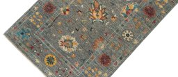 Backside of handmade New Farahan rug showing knot structure and weave density