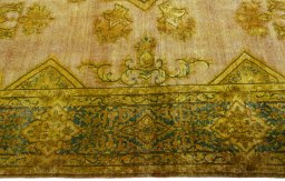 Corner detail of 1950s Vintage rug showing border pattern and Wool pile