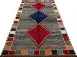 Surface texture of 1970s Persian Gabbeh rug with natural Wool and intricate pattern