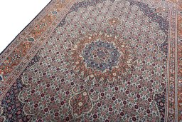 Backside of handmade 2000s Moud rug showing knot structure and weave density