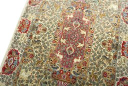 Backside of handmade New Ghom rug showing knot structure and weave density