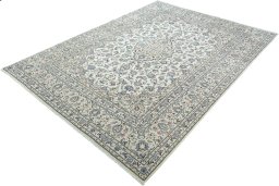 Corner detail of 2000s Kashan rug showing border pattern and Wool pile