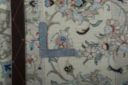 Backside of handmade New Kashan rug showing knot structure and weave density