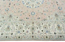 Corner detail of New Kashan rug showing border pattern and Wool pile
