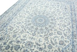 Backside of handmade New Nain rug showing knot structure and weave density