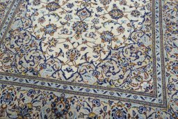 Close-up detail of 2000s Kashan rug from Iran / Persia showing Wool weave