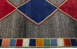 Close-up detail of 1970s Persian Gabbeh rug from Iran / Persia showing Wool weave