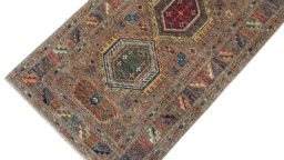 Backside of handmade New Kazak rug showing knot structure and weave density