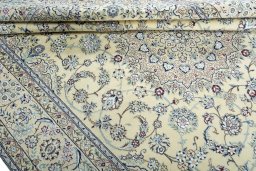 Close-up detail of 2000s Nain rug from Iran / Persia showing Wool weave