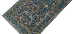 Backside of handmade New Farahan rug showing knot structure and weave density