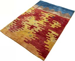 Corner detail of 2000s Persian Gabbeh rug showing border pattern and Wool pile