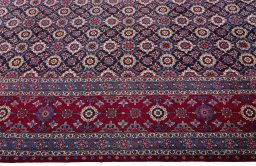 Close-up detail of 2000s Mashad rug from Iran / Persia showing Wool weave