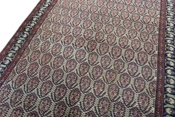 Backside of handmade 1930s Hamedan rug showing knot structure and weave density