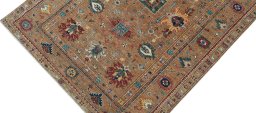 Backside of handmade New Kazak rug showing knot structure and weave density