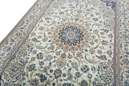 Backside of handmade 2000s Nain rug showing knot structure and weave density