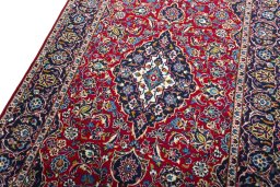 Backside of handmade 2000s Kashan rug showing knot structure and weave density