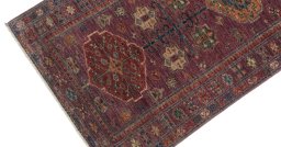 Backside of handmade New Kazak rug showing knot structure and weave density