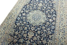 Backside of handmade 2000s Nain rug showing knot structure and weave density