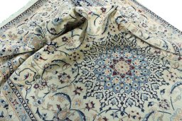 Surface texture of 2000s Nain rug with natural Wool and intricate pattern