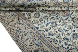 Close-up detail of 2000s Kashan rug from Iran / Persia showing Wool weave