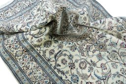 Surface texture of 2000s Nain rug with natural Wool and intricate pattern