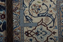Backside of handmade 2000s Nain rug showing knot structure and weave density