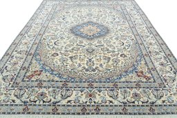 Surface texture of 2000s Nain rug with natural Wool and intricate pattern