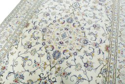 Backside of handmade New Kashan rug showing knot structure and weave density