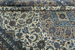 Close-up detail of 2000s Kashan rug from Iran / Persia showing Wool weave