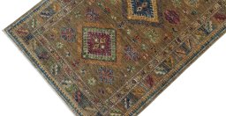 Backside of handmade New Kazak rug showing knot structure and weave density