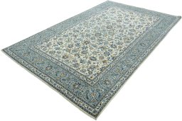 Corner detail of 2000s Kashan rug showing border pattern and Wool pile