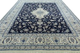 Surface texture of 2000s Nain rug with natural Wool and intricate pattern