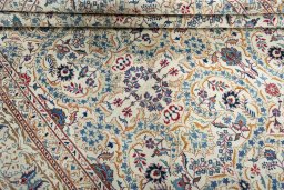 Corner detail of 1950s Kashan rug showing border pattern and Wool pile