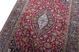 Backside of handmade New Kashan rug showing knot structure and weave density