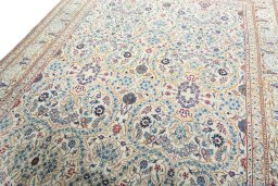 Backside of handmade 1950s Kashan rug showing knot structure and weave density