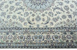 Corner detail of 2000s Nain rug showing border pattern and Wool pile