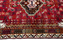 Full view of 1970s Shiraz rug from Iran / Persia, 254 × 153 cm in Red tones