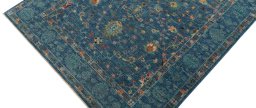 Backside of handmade New Farahan rug showing knot structure and weave density