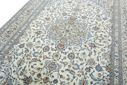 Backside of handmade 2000s Kashan rug showing knot structure and weave density