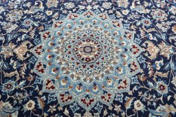 Central medallion detail of 2000s Nain rug from Iran / Persia