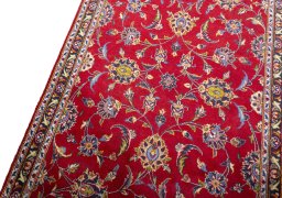 Backside of handmade 2000s Kashan rug showing knot structure and weave density